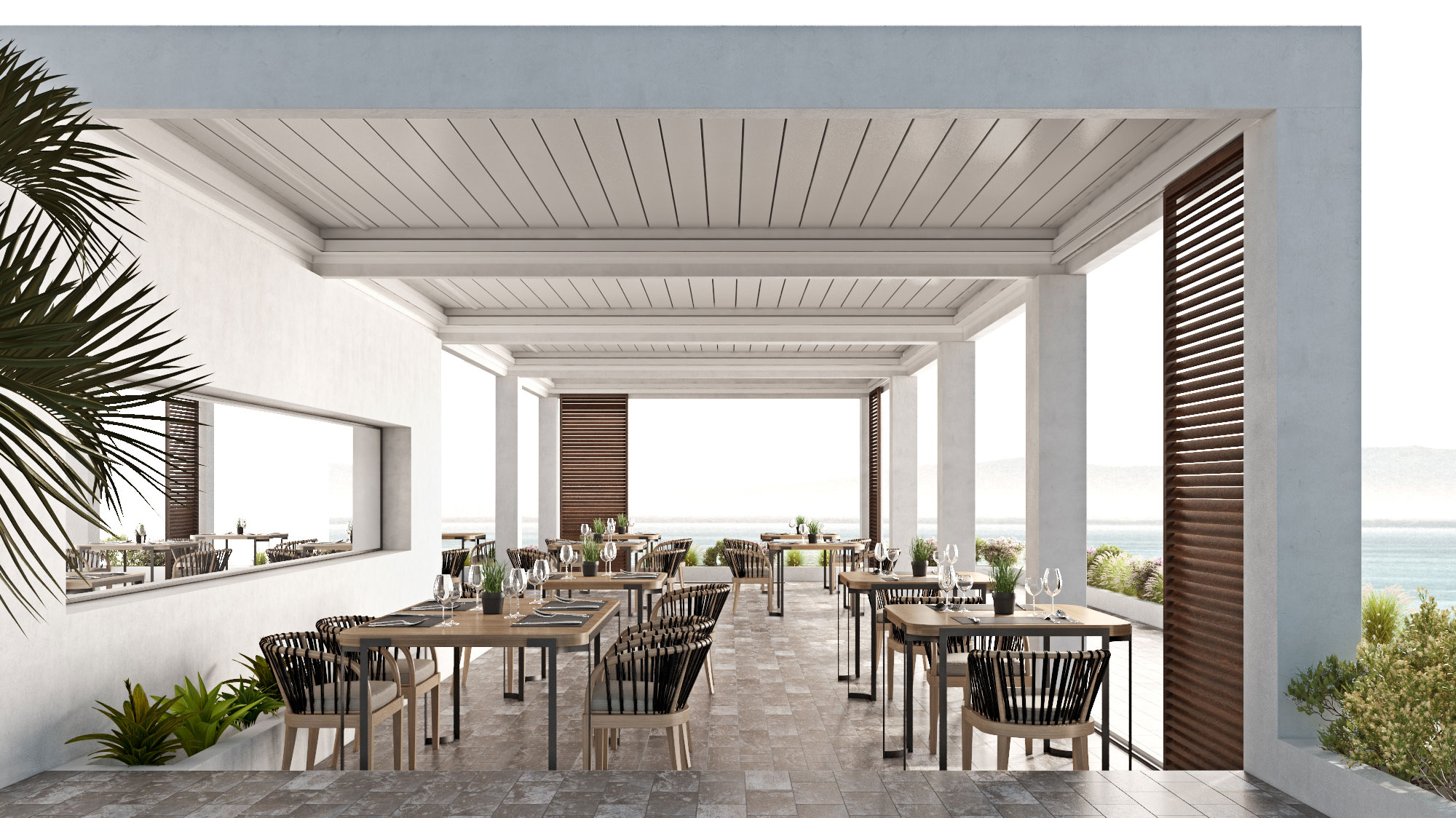 Pergola bioclimatica bianca nella terrazza di un ristorante sul mare.